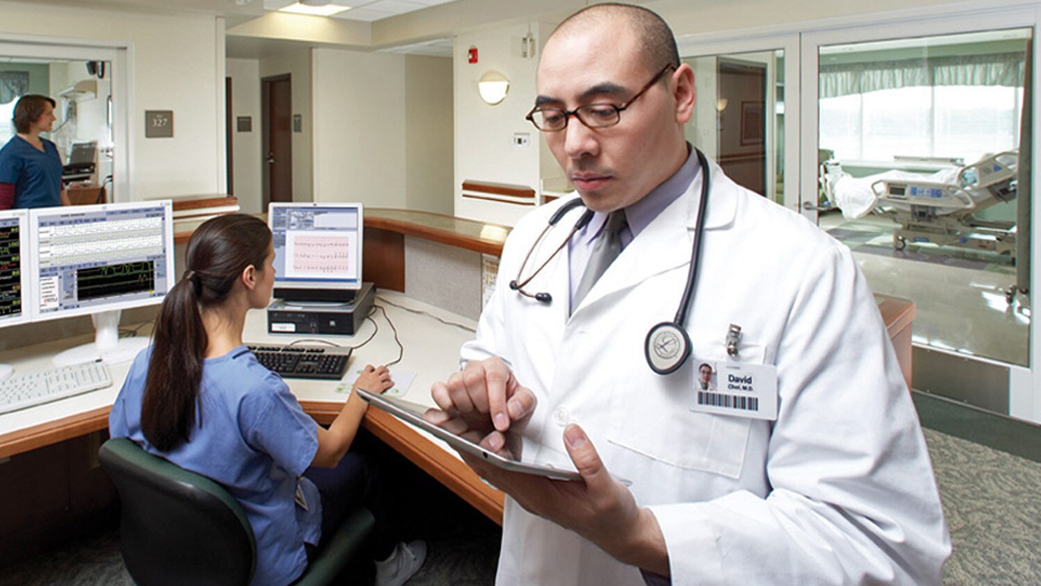 Male doctor consulting a tablet